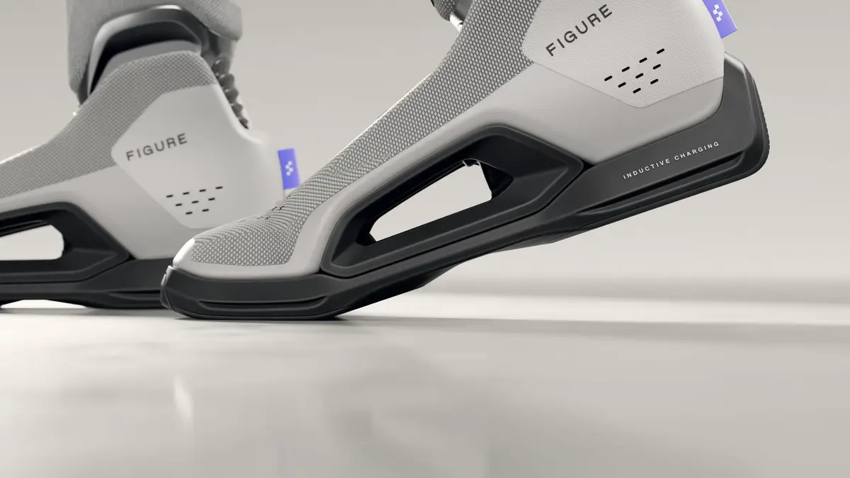 Detailed view of the Figure 03's articulated feet, showing the hollow arch and the 'Inductive Charging' label on the heel.
