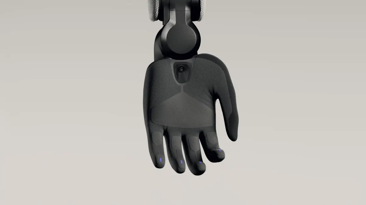 A close-up of the Figure 03's hand, revealing a camera sensor in the palm and a glove-like covering.