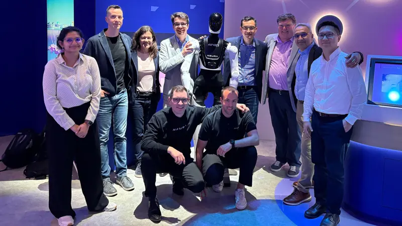 The NEURA Robotics team with a 4NE-1 humanoid robot