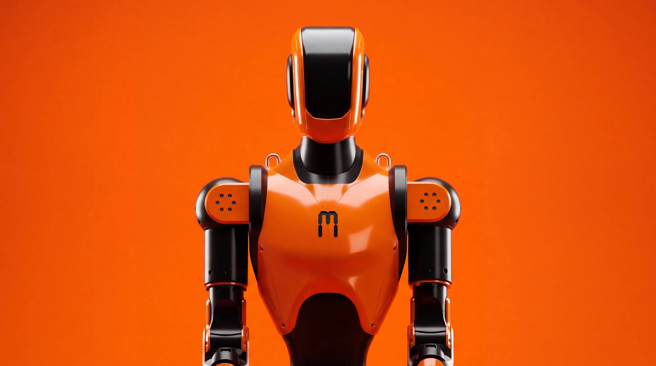 Front-facing studio shot of the Asimov 1 humanoid robot against an orange background, highlighting its glossy orange chest plate with the Menlo logo, black head visor, and articulated shoulder joints.