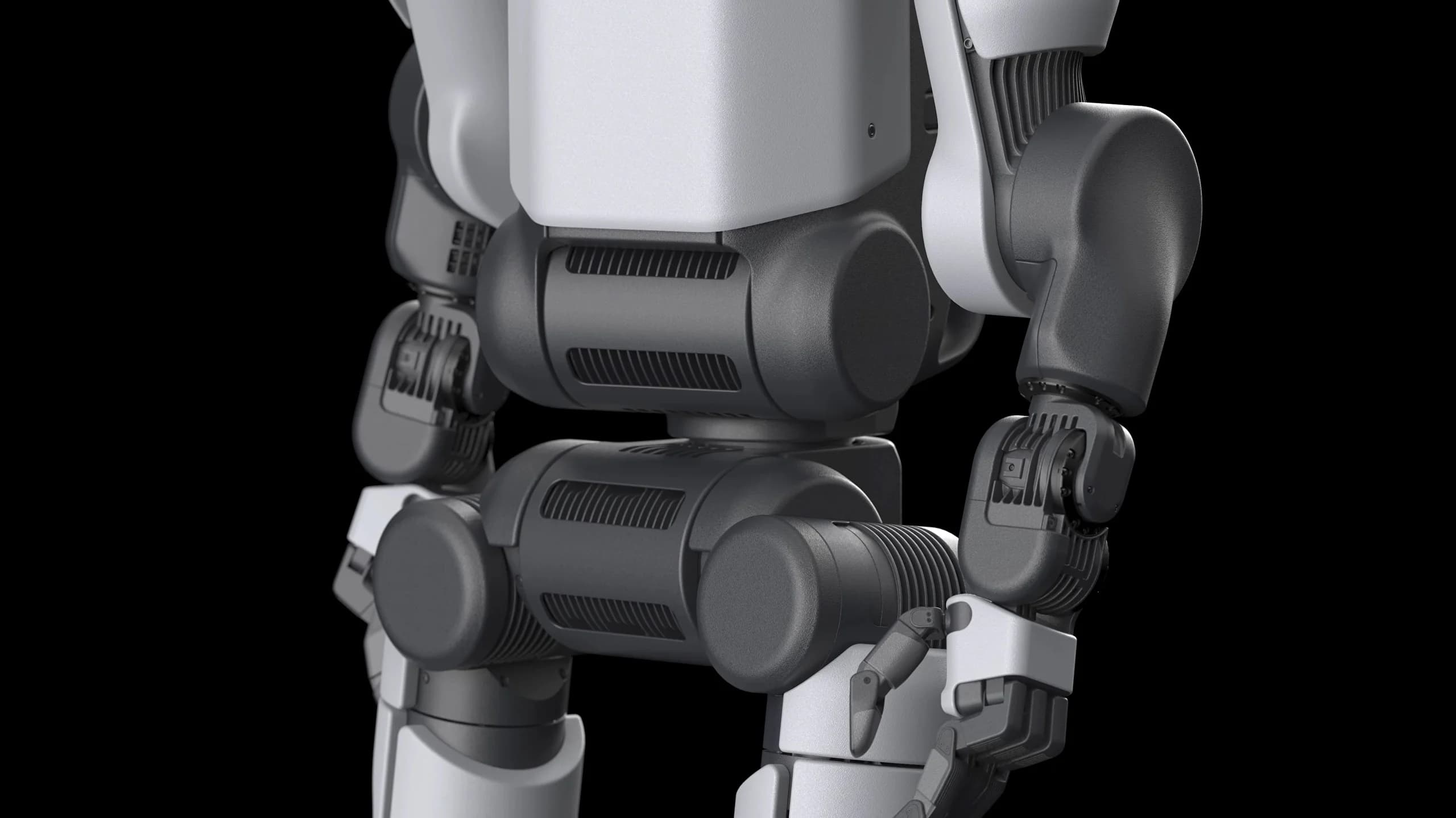 A close-up view of the back and pelvic area of the Atlas robot, showing prominent horizontal cooling fins integrated into the dark grey joint housings.