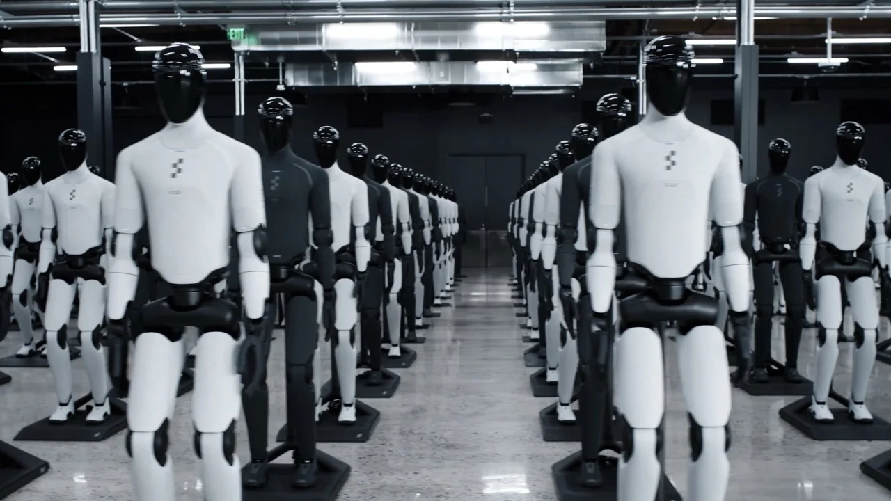 A ground-level perspective from the center of a production floor, showing symmetrical rows of white and charcoal-grey Figure 03 humanoid robots stretching into the background of the BotQ industrial facility.