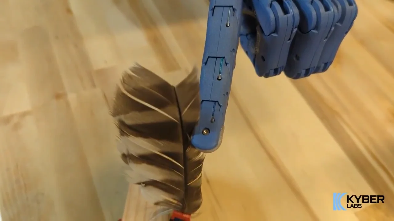 Kyber Labs robotic hand touching a feather