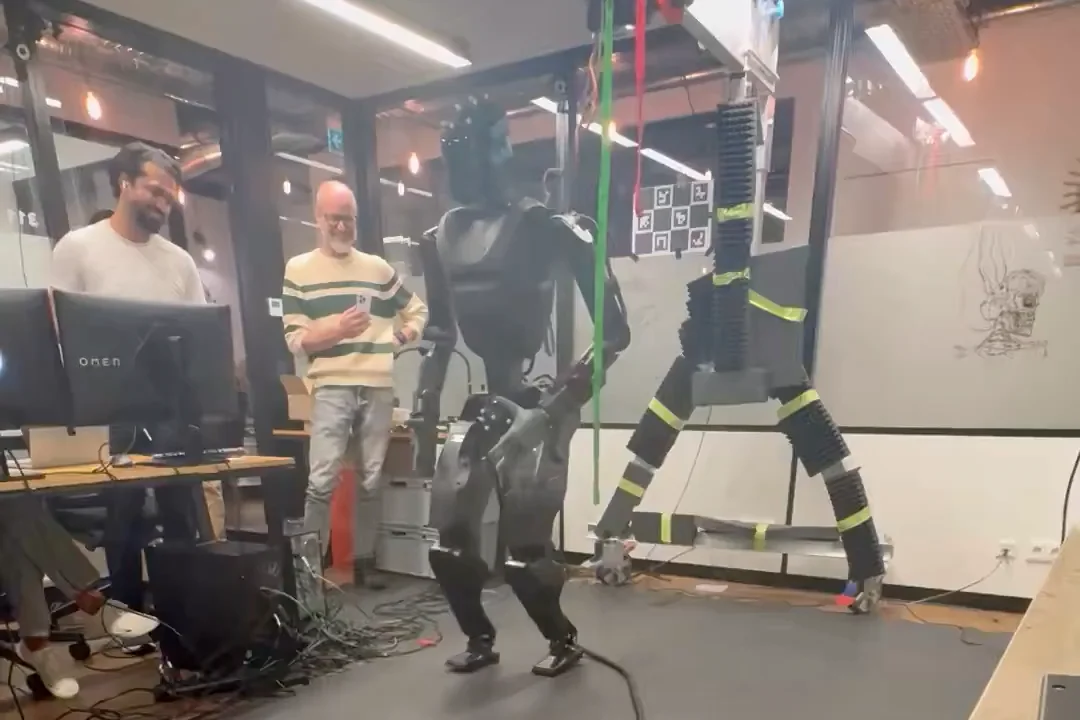 An image of Foundation Phantom humanoid robot walking in a lab setting