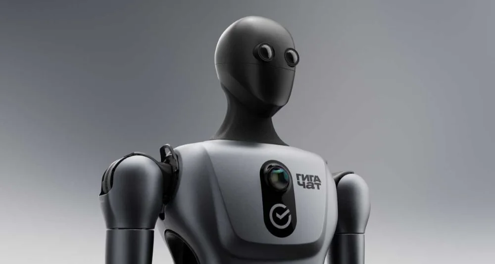 Close-up of the Green robot's head and upper torso, showing its sleek white casing and black visor