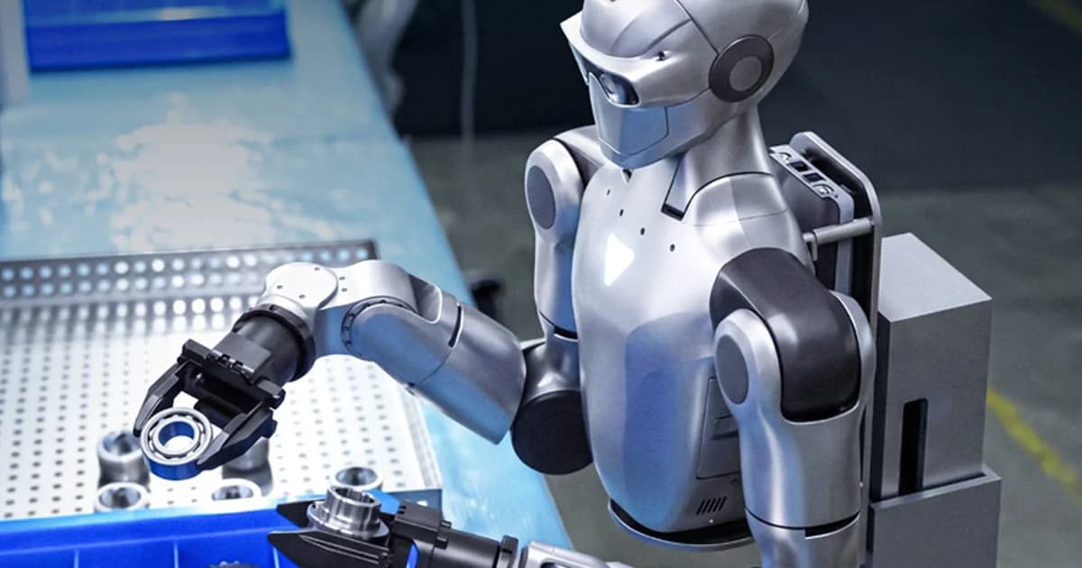 A silver Unitree Dual-Arm Humanoid robot torso, mounted to a fixed industrial base, uses two-fingered grippers to perform precision assembly with metal bearings at a workbench.
