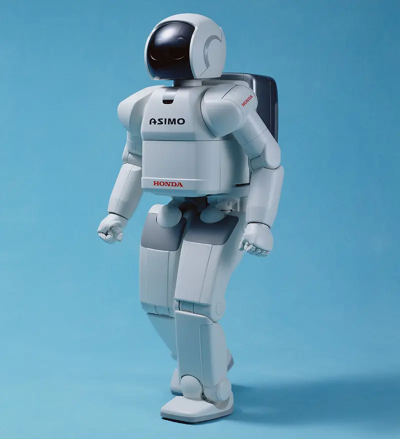 Honda Asimo Humanoid Robot Walking on a blue background