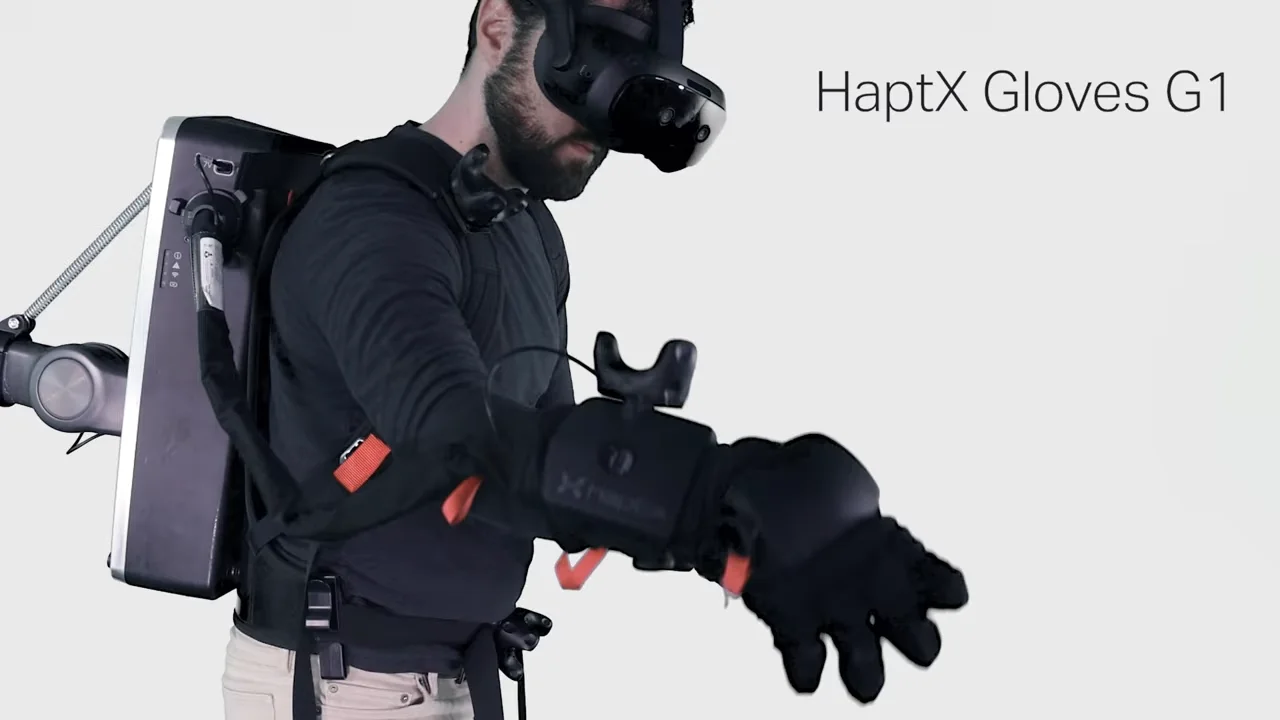 Close-up of the HaptX gloves G1, showing the complex exoskeleton and pneumatic tubes used to simulate touch.