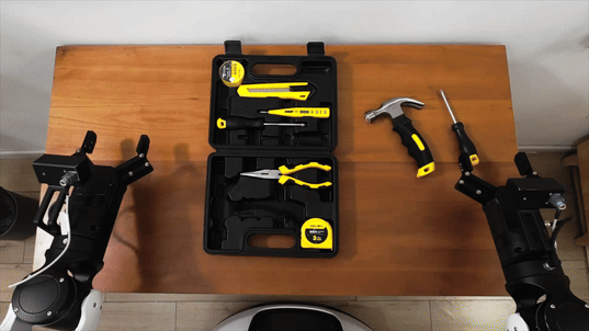 Annotated robot demonstration of returning tools to a toolbox.