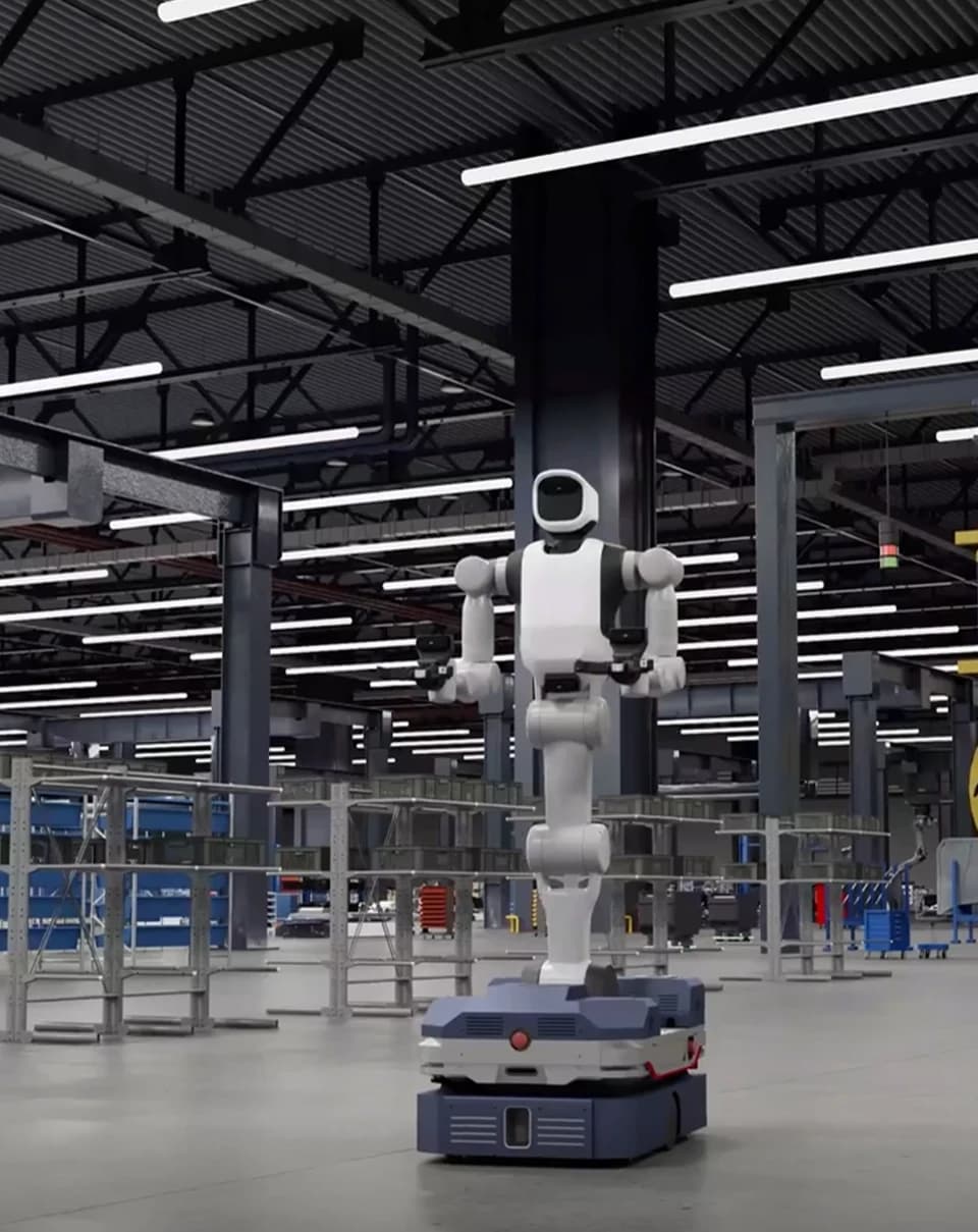 Full-body view of an Agile Robots humanoid mounted on a mobile base in an industrial setting.