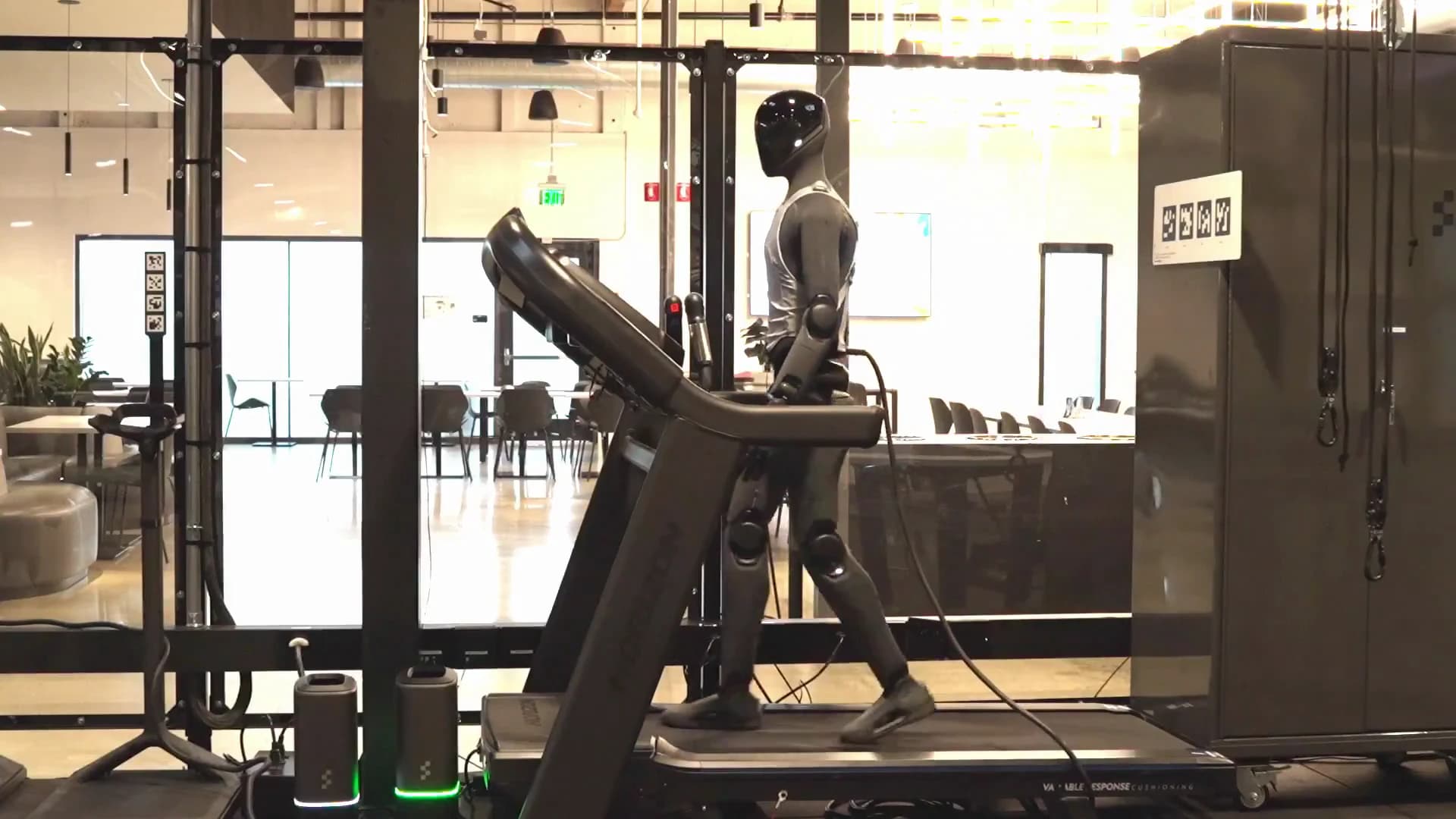 Figure 03 humanoid walking on a treadmill in a test area at Figure.