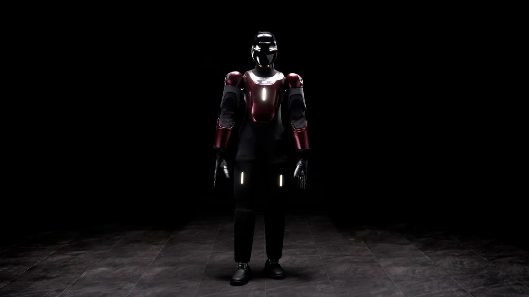 Generative Bionics' GENE.01 humanoid standing on a dark tiled floor against a black background, with a glossy black helmet and visor, a deep red lacquered chest plate and upper arms over black limbs, thin white light strips on the chest and thighs, and dark articulated five-finger hands.