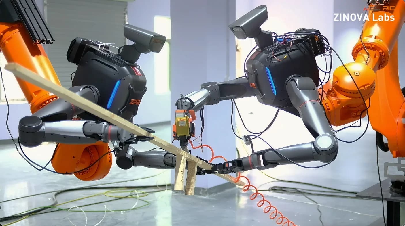 Two LimX TRON 2 dual-arm robotic torsos mounted onto heavy orange industrial robotic arms, working collaboratively to hold a wooden board and operate a pneumatic nail gun over a concrete formwork structure.