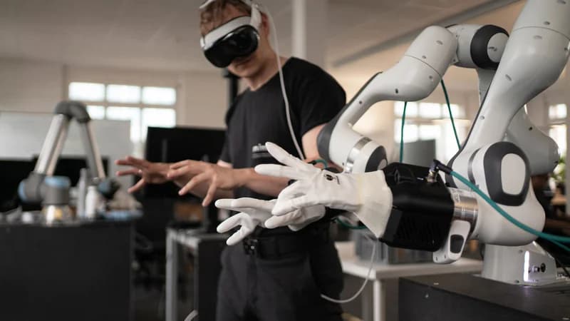 Mimic Robotic hands being teleoperated by a person wearing a VR headset