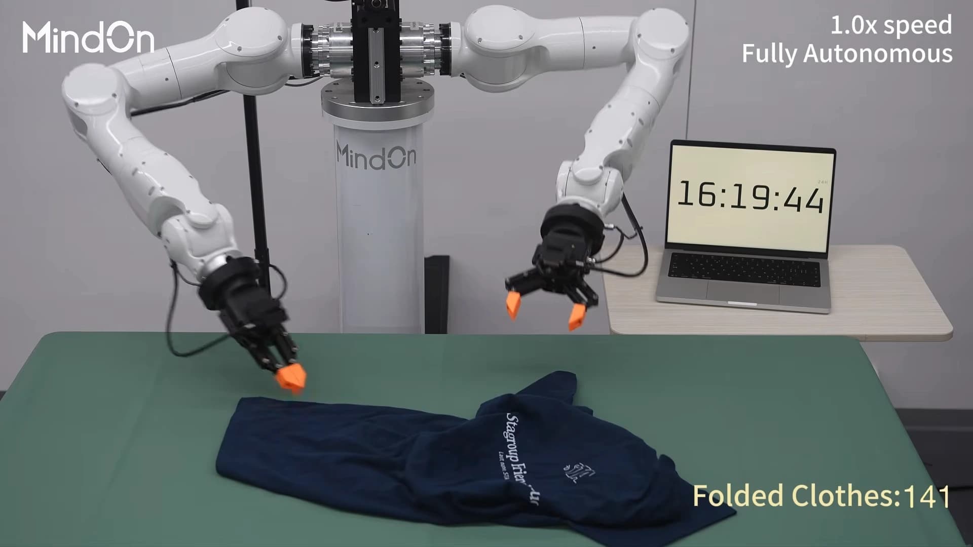 MindOn’s dual-arm robot folding a dark shirt, with an on-screen counter reading 141 folded clothes.
