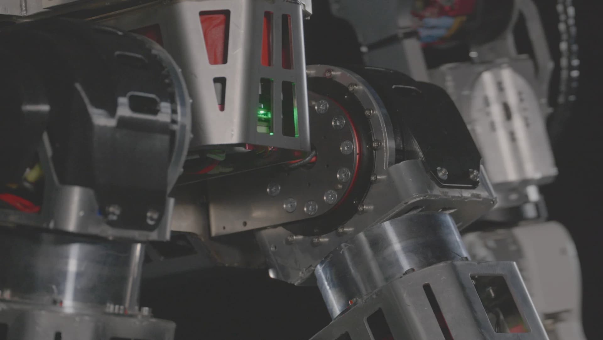 Close-up of the Roger prototype’s hip joints and exposed mechanical components.