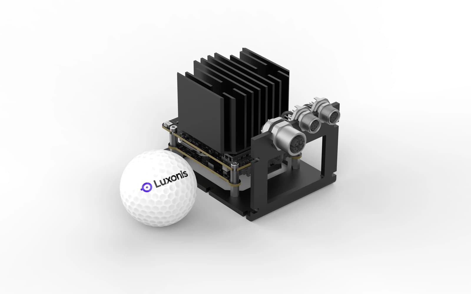 OAK 4 FFC developer kit beside a Luxonis-branded golf ball.
