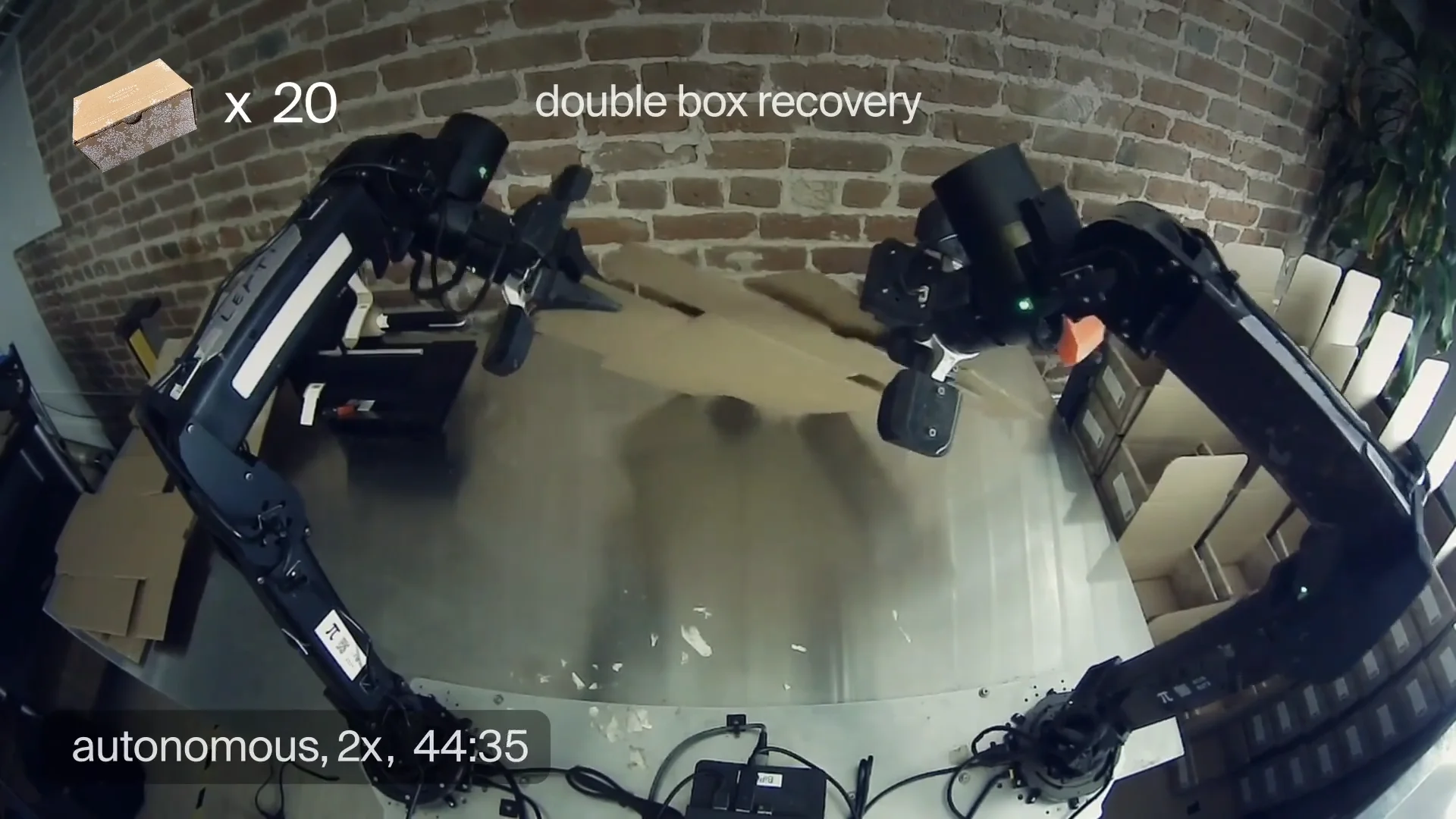 A robot arm separating two stuck-together pieces of cardboard packaging.