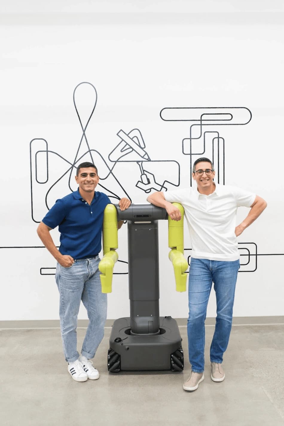 Figure 7: The Maven machine. An omnidirectional wheeled base, a telescoping pillar and two 7-DOF arms carrying modular end effectors. Source: Maven Robotics.