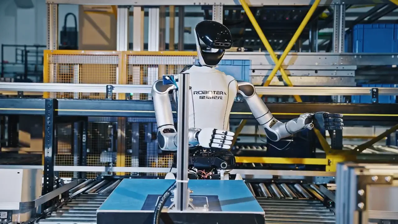 The upper body of the Robotera Star-Act L7 humanoid robot standing at a conveyor belt workstation, ready to process inventory.