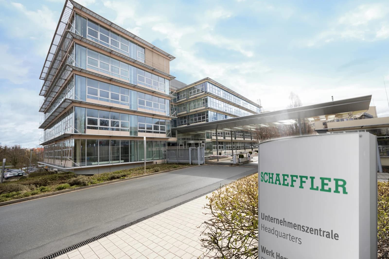 Schaeffler headquarters in Herzogenaurach, with office buildings and the company sign beside the entrance.