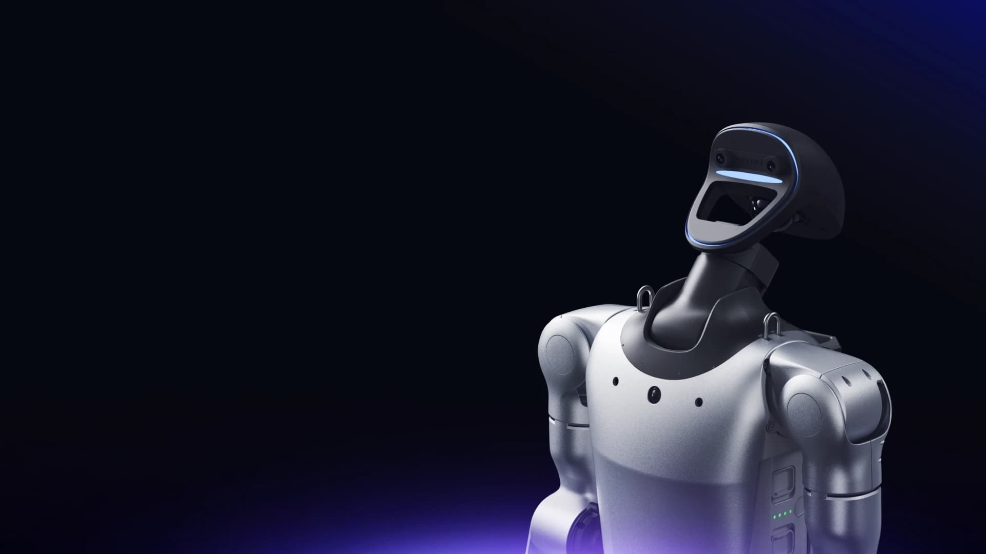 Unitree G1+ with its head tilted upward, showing the articulated neck above its silver torso.