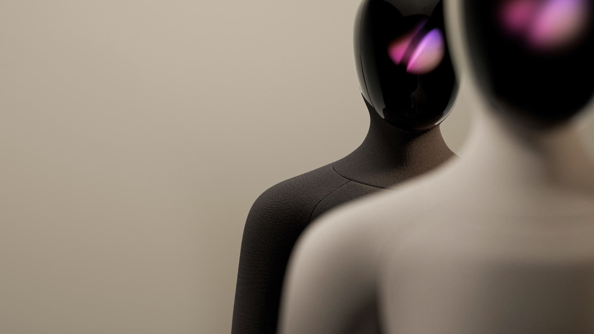 Design visualization showing two Vesoma 1 humanoids with purple-lit dark faces, one in focus behind a blurred foreground figure.
